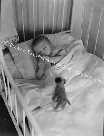 BABY IN COT